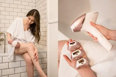 Kobieta używa depilatora Philips Lumea 9900. W dłoni trzyma urządzenie, a na drugiej dłoni ma trzy wymienne końcówki.